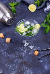 Obraz na płótnie Canvas Martini cocktail with lime and mint.