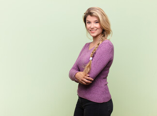 smiling to camera with crossed arms and a happy, confident, satisfied expression, lateral view