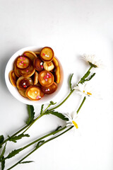Meal with daisies and mini pancakes. Trendy breakfast with daisies