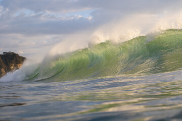 Waves breaking in Japan. The Pacific Ocean & its waves often generated by a Typhoon. The stunning...