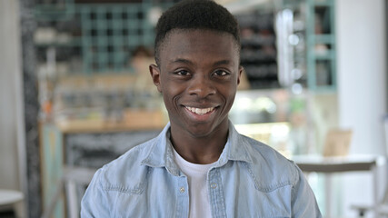 Obraz premium Portrait of Young African Man Shaking Head in Approval, Yes