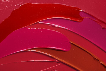 Lip gloss or lipstick pink red orange smudge background texture