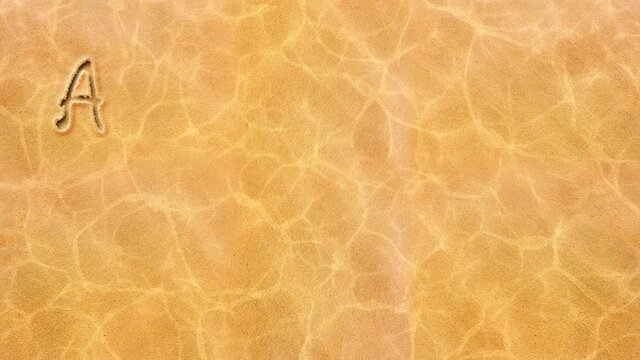 The animated inscription on the sand is the English alphabet.
