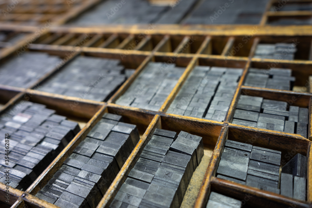 Fototapete printing drawer with grids to organize the types of typography that are inside, focus selective, ind