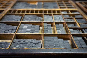 Printing drawer with grids to organize the types of typography that are inside, old printing, focus selective, industry concept