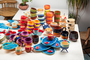 handmade design ceramic cups, pots, plates, mugs full of colors