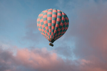 Blue sky background with white dramatic clouds and hot air balloon