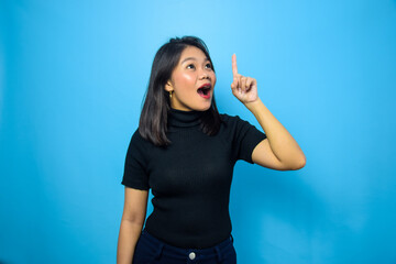 Fototapeta premium Portrait of Young beautiful asian women wearing black turtle neck shirt with blue isolated background