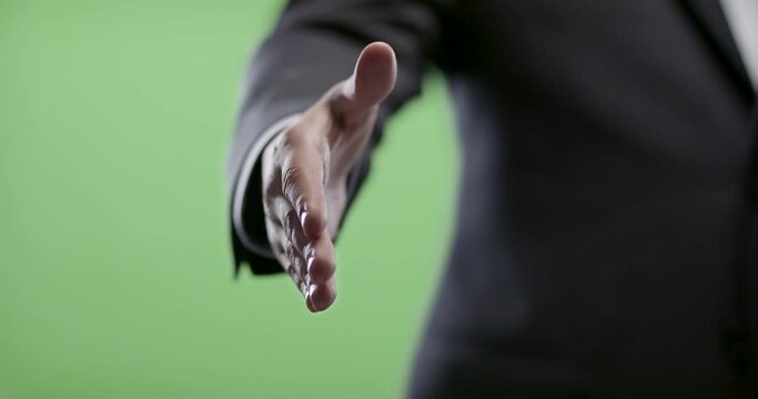 Handshake from Businessman on green screen. Shot in slow-motion in 4k on green screen.