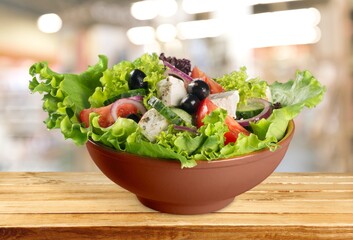 Fresh vegetable salad with cheese in a bowl