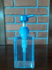 Fototapeta na wymiar blue soap dispenser