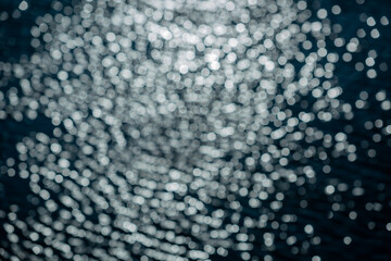 Abstract blue and white bokeh with black Beauty background