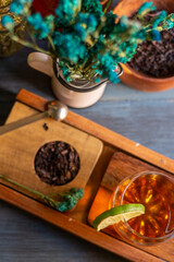 black tea on a vintage background, for a hot day, organic with a bottle