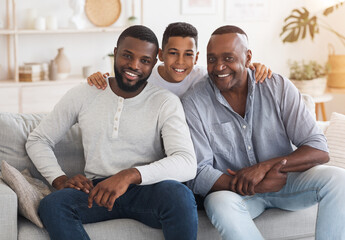 Black Preteen Boy Embracing Father And Granddad At Home, Posing To Camera