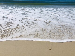 ocean foam on the sand
