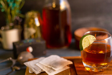 black tea on a vintage background, for a hot day, organic with a bottle