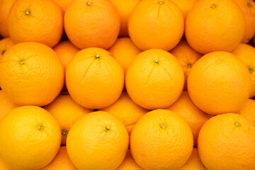 Closeup of fresh oranges in grocery supermarket.