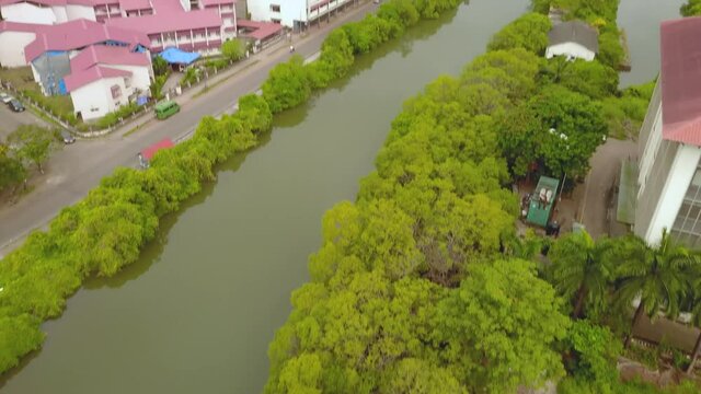 A drone shot flying over the river in Panjim, Goa, India.