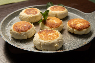 Yummy cheese pancakes served on a pan
