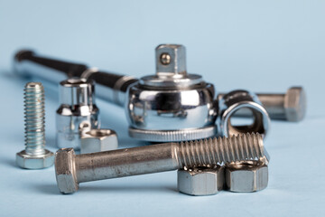 a mechanic's ratchet socket wrench with an assortment of nuts and bolts