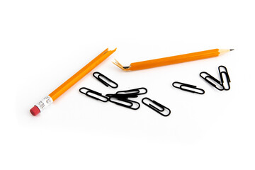 a broken pencil and paper clips getting ready for frustration at tax time