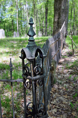old broken cemetery iron fence