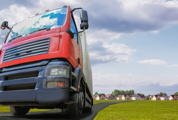 truck moves on the road from the village