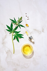 Medical marijuana cannabis cbd oil. CBD oil hemp products. Macro detail of dropper with CBD oil,...