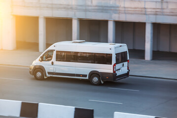 Minibus travels on a city lane