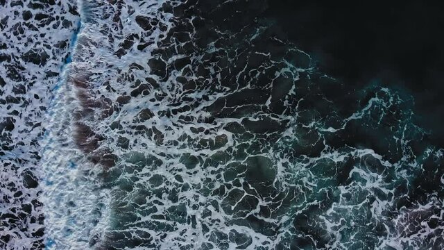 Aerial view to ocean waves. Blue water background in Costa Rica at the Caribbean between Puerto Viejo, Manzanillo and Punta Uva