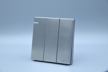 Three gang switch grey color on grey background