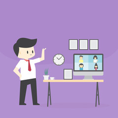 businessman stand front and point of work table using Webcam conference on a computer with diverse colleagues And working at homework through computer And the internet