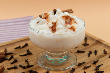 bowl of hominy (Canjica) on a wooden tray,