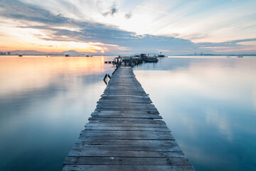 Fototapeta premium Real wooden bridge view of sunrise background