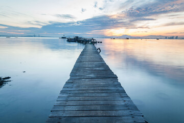 Fototapeta premium Real wooden bridge view of sunrise background