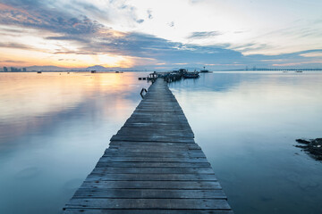 Fototapeta premium Real wooden bridge view of sunrise background