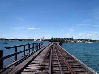 Fototapeta premium Railroad tracks on bridge across Back Cove in Portland.