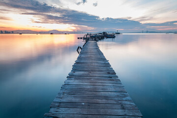 Fototapeta premium Real wooden bridge view of sunrise background
