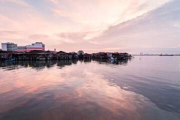 Wooden bridge Clan Tan Jetty view during sunrise in George Town, Penang