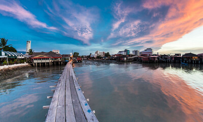 Wooden bridge Clan Tan Jetty view during sunrise in George Town, Penang