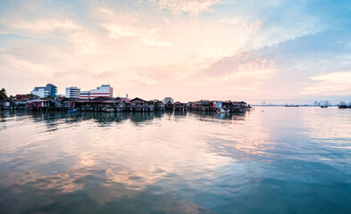 Wooden bridge Clan Tan Jetty view during sunrise in George Town, Penang