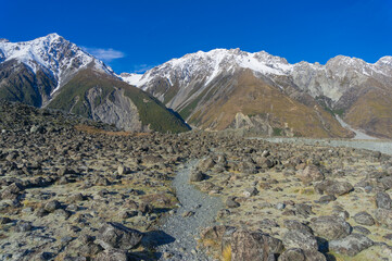 Hiking path in mountain valley. Winter mountain landscape with hiking track