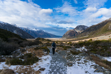 People hiking. Winter mountain landscape with foot path and snow