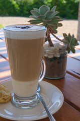 Coffee drink in a tall glass Flat white or cappuccino