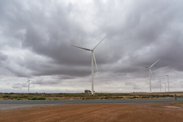 Wind farm with wind turbines windmills generating sustainable electricity
