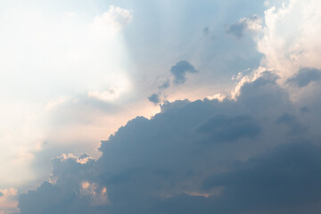 
Beautiful dramatic gray and white clouds on blue sky, variety of shapes, silhouettes and shades at sunset time