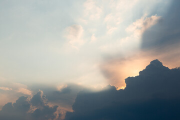 
Beautiful dramatic gray and white clouds on blue sky, variety of shapes, silhouettes and shades at sunset time