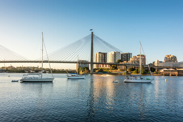 Sydney cityscape with harbor view, ANZAC bridge and boats