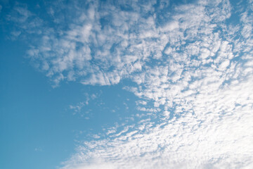 The picture of the blue sky and floating clouds