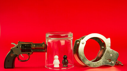 concept of crime, punishment and defense. society and equal rights. gun, handcuffs and people of...